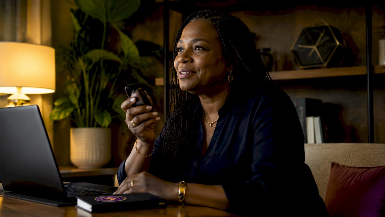 Woman recording personal family history at home